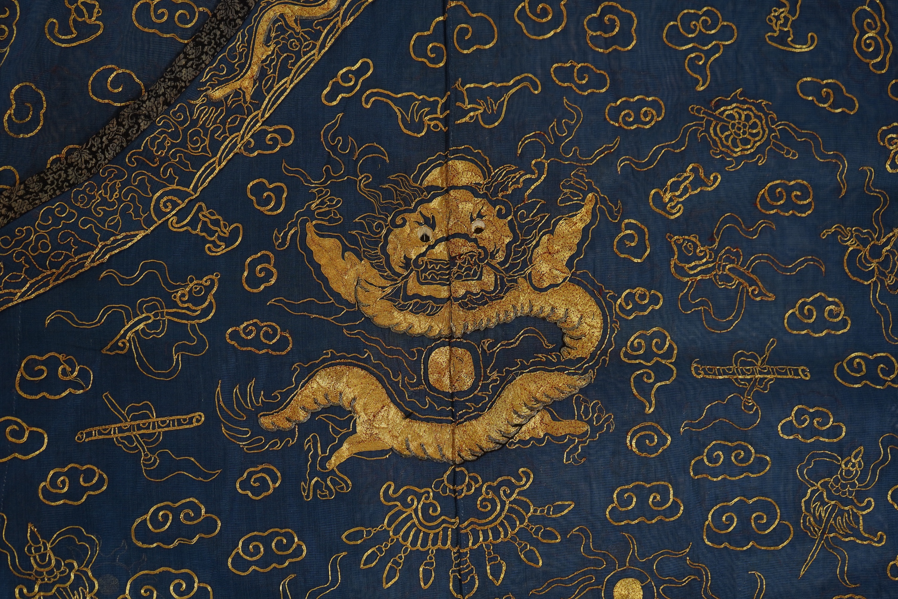 A Chinese gold thread and silk gauze ‘dragon’ summer robe, jifu, early 20th century